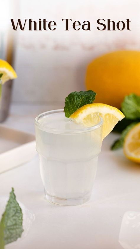 white tea shot in shot glass garnished with mint and lemon. White Tea Shot Recipe, White Party Foods, Shots Alcohol Recipes, Tea Cocktail Recipes, Fruity Alcohol Drinks, White Drinks, Tea Drink Recipes, Coctails Recipes, Cocktail Shots