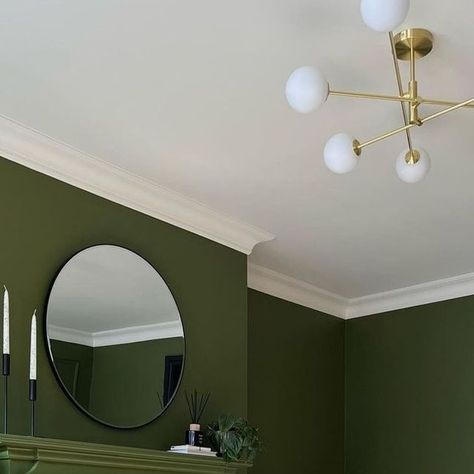 Little Greene on Instagram: "@georginaraineinteriors opts for Olive Colour on her walls, woodwork and fireplace to create a bold look in her living space, paired with Silent White on her ceiling." Little Greene Olive Colour, Green Chimney Breast Wall, Olive Living Rooms, Olive Colour, Olive Green Walls, White Fireplace, Fire Surround, Chimney Breast, Green I