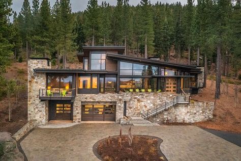 Modern Lake Home Exterior, Modern Mountain Home On Slope, Forest Modern House Exterior, Lake Modern House, Winter Luxury House, Home Built Into Hillside, Modern Mountain Home Exterior Architecture, Camp Design Architecture, Mountain Modern Exterior Architecture