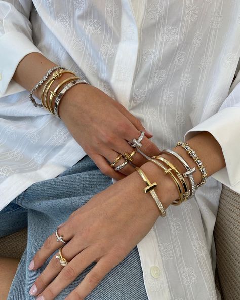 11 Luxury Pieces That Are Worth the Investment | Who What Wear UK Tiffany T Bracelet Stack, Investment Jewelry Pieces, Stacked Bracelets Aesthetic, Tiffany Stack, How To Stack Bracelets, Bracelet Stack Aesthetic, Mixing Metals Jewelry, Tiffany & Co, Luxury Bracelet Stack