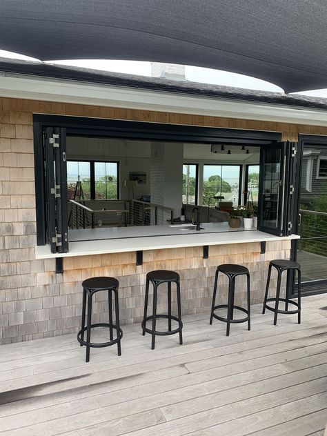 Kitchen To Backyard Transition, Kitchen Opens To Patio, Folding Open Kitchen Window To Bar, Kitchen Window Outdoor Bar Counter, Open Kitchen With Windows, Outdoor Enclosed Kitchen, Bar Window To Outside, Indoor Outdoor Bar Window, Outdoor Bar Window