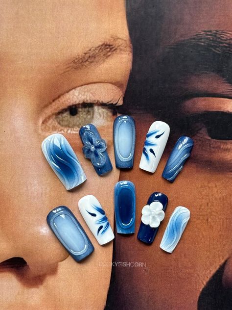 Blue spray nails/Trendy nails/Blue press on nails long /Blue nails/3d flower nails/Dreamy nails/blue and white porcelain nail 💌 E A C H  O R D E R  C O N T A I N S -  10 Handcrafted Press-On Nails -  Nail Glue  -  Sticky tabs -  Cuticle pusher -  Nail File/ Buffer 📏S I Z E ？ - Use a tape measure to measure the widest part of the nail diameter - Match the corresponding size chart according to the size of each nail - Recommended to use the largest size if there is no exact match - Customized sizes are supported - Need to select the custom option 🔍U S I N G ? - Clean the surface of the nails, make sure the surface is dry, and use jelly stickers or nail glue to stick them - Do not touch water within 2 hours after wearing - For better adherence in cold conditions it is best to warm up the st What Matches With Blue, North Carolina Nails, Navy Blue Gel X Nails, Blue Acrylic Nail Designs Ideas, Square Builder Gel Nails, Red Blue And White Nails, Blue 3d Nail Art, Carribean Blue Nails, Delft Blue Nails