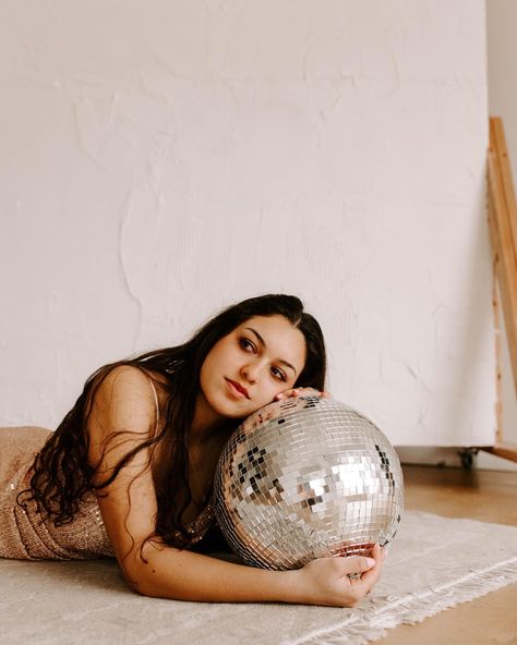 Girl rests her head on disco ball Disco Ball Studio Photoshoot, Disco Ball Branding, Disco Ball Photo Shoot, Discoball Photoshoot Ideas, Fun Studio Photoshoot Ideas Creative, Ball Pit Photoshoot, 70s Witch, Disco Shoot, Studio Photoshoot Ideas Creative