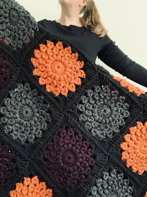 Fall Inspired Crochet Blanket, Quick Granny Square Crochet Blanket, Halloween Themed Crochet Blankets, Fall Colours Crochet Blanket, Goth Crochet Blanket Patterns Free, Super Chunky Granny Square Blanket, Pokeball Granny Square, Crochet Sunburst Granny Square Pattern, Crochet Sunburst Blanket