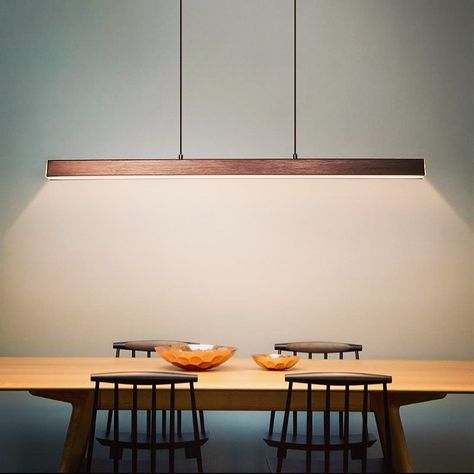 The Modern LED Linear Suspension Light is a clean, minimalist design. A long rectangular shape outlines the construction accentuated by a neat flat surface. LEDs follow every edge of the housing, creating a true marriage of form and function.  #kitchenlighting #homeimprovement #homedecorating Long Hanging Lights, Office Lights, Mood Photos, Nordic Restaurant, Brown Lamps, Glass Chandeliers, Painting Lamp Shades, Lights Hanging, Kitchen Lights