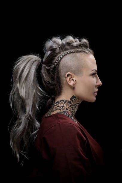 Side portrait of a tattooed viking blonde female and her unique hairstyle Viking Hair Braids Women, Female Viking Braids, Viking Braids Undercut, Viking Hair Shaved Sides, Short Viking Hair, Female Warrior Hairstyles, Viking Undercut Women, Viking Mohawk Woman, Viking Hair Shaved Sides Women