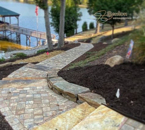 A paver walkway with some stone steps to travel down to the dock from a lakeside home along Lake Wylie. House Walkway, Side Walkway, Lakehouse Ideas, Lake Wylie, Lake Houses Exterior, Concrete Walkway, Outdoor Walkway, Paver Walkway, Stone Steps