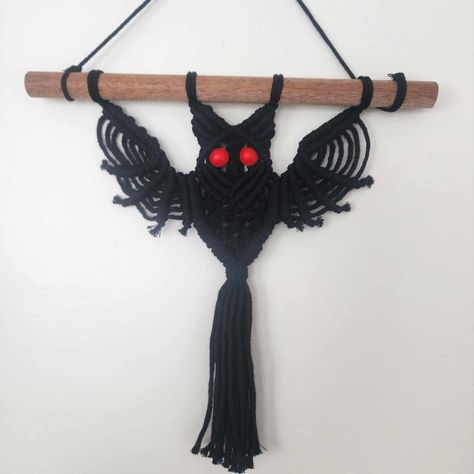 The Bat-Shaped Macrame Product Is A Stunning Example Of The Witchy Style. It Features Intricate Knotting Techniques That Create The Distinct Shape Of A Bat. The Black Macrame Cord Used To Make The Product Adds To Its Dark And Mysterious Aesthetic. Get This Spooky Little Bat For Your Halloween Or Year Round Decor! Measurements: 12" Wide 11" Long Without Hanger 18" With Hanger Macrame Product, Mysterious Aesthetic, Year Round Decor, Witchy Style, Black Macrame, Witchy Fashion, Macrame Art, Macrame Projects, Macrame Cord