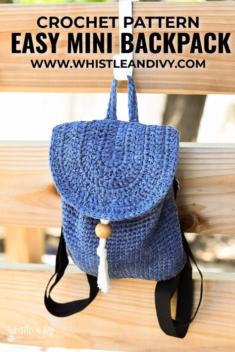 This cute crochet mini backpack is a cute way to carry your essentials! It's easy construction and simple instructions make it perfect for an advanced beginner crocheter. It uses soft tape yarn which gives it a sturdy construction and quick to work up. It even has an ingenious button and bead closing mechanism. #crochetbackpack #crocheminibackpack #easycrochet #moderncrochet #whistleandivy #simplecrochet #crochetforteens #summercrochet Crochet Mini Backpack Free Pattern, Free Crochet Backpack Pattern, Crochet Backpack Free Pattern, Beginner Crochet Bag, Crochet Mini Backpack, Kids Backpack Pattern, Crochet Mini Bag, Loom Crochet, Crochet Backpack Pattern