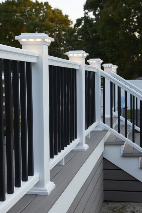 Our composite railing collection offers the most customization and style options to complement your decking. Not only that, it brings resilience to stand strong against more challenging climates with durability that goes well beyond the surface. Check out more of the features of our lineup. Railing: Classic Composite Series - Premier Rail - White Gray And White Deck, Diy Front Porch Railing Ideas, House Railings Outdoor, Deck Stairs To Patio, Under Deck Skirting Ideas, Composite Deck Ideas, Diy Deck Decor, Trex Deck Colors, Deck Paint Colors