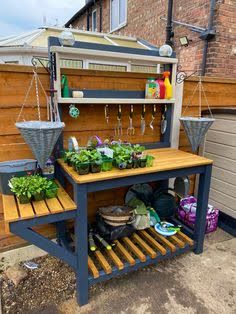 This contains an image of: Home made potting bench Cuprinol Urban Slate, Furniture Projects Diy, Planting Bench, Potting Benches Diy, Benches Diy, Garden Work Bench, Potting Bench Ideas, Pallet Potting Bench, Diy Potting Bench