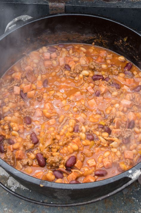 Cowboy Beans an award-winning recipe. Step by Step directions for cooking with Cast Iron Dutch Oven over Charcoal and additional directions for Baking or Crock-Pot to fit everyone's needs. These Baked Beans can be served as a side dish or a meal. Perfect recipe for BBQ Potlucks and Camping. #lodgecastiron #devourdinner #devourpower #cowboybeans #easyrecipe #familyrecipe #BBQWeek #dutchoven #dutchovencooking #bakedbeans #dutchovenbeans #iammartha #fathersdayrecipe #campingmeals #campingrecipe Cowboy Beans Crockpot, Cowboy Bean Soup, Camping Side Dishes, Cowboy Beans Recipe, Beans Crockpot, Dutch Oven Soup, Bacon Beans, Beans Instant Pot, Ceramic Dutch Oven