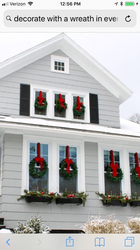 Wreath Above Garage Door, Wreath On Every Window, Wreaths On All Exterior Windows, Christmas Wreaths On House Windows, Christmas Wreath For Window, Exterior Xmas Decorations, Decorating Windows For Christmas Outside, House With Christmas Wreaths On Windows, Window Christmas Wreaths Outdoor