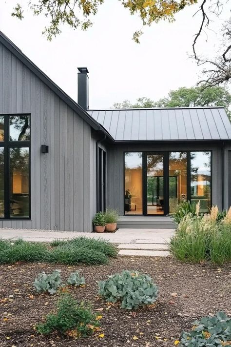 Modern Scandinavian house with gray facade, large windows, and lush greenery. These Scandinavian modern houses are a hug of architecture — a sleek, nordic sanctuary with a dash of whimsy. Nordic Home Exterior, Modern Korean House Exterior, Modern Korean House, Korean House Exterior, Scandinavian Modern Interior, Scandinavian Barn House, Modern Scandinavian House, Cottage Exterior Colors, Scandinavia House