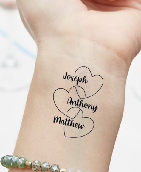 Grandbabies Tattoo Ideas, Tattoo Ideas For Grandkids Names, Nice And Nephew Tattoos, Child Birth Tattoo Ideas, Grandkids Tattoo Ideas For Grandma, Nieces And Nephews Tattoo, Tattoo For Multiple Kids, Niece Nephew Tattoo, Tattoo Ideas For Nephews