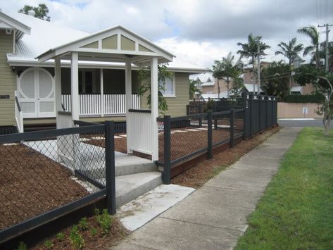 chain link fence with wood posts with gable entry. Chain Link Fence Front Yard, Black Chain Link Fence Ideas, Black Chain Link Fence Ideas With Wood, Black Chain Link Fence Front Yard, Wood Over Chain Link Fence, Chainlink Fence With Wooden Posts, Black Chain Link Fence With Wood, Wood Fence On Chain Link, Wood Fence On Top Of Chain Link