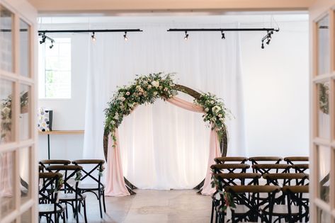 Circular ring arch way for wedding ceremony and reception. Pink drapery hanging with floral pieces attached in front of a white drapery. Arch Way, Circle Arch, Wedding Archway, White Drapery, Micro Wedding, Wedding Ceremony, Arch, Weddings, Ring