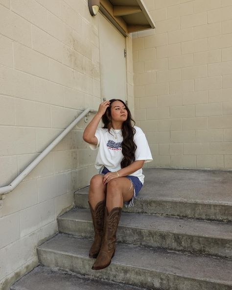 Vintage Ts 🤝🏽 cowboy boots _______ fall outfits // denim // cowboy boots // comfy casual #falloutfitideas #countryconcertoutfit #denimoutfit Comfy Cowboy Boots Outfit, Cowboy Boot Fall Outfits, Boot Fall Outfits, Gameday Cowboy Boots Outfit, Pregnant Cowboy Boots Outfit, Denim Mini Skirt Outfit Cowboy Boots, Lexi Hidalgo Cowboy Boots, Fall Outfits Denim, Denim Cowboy Boots