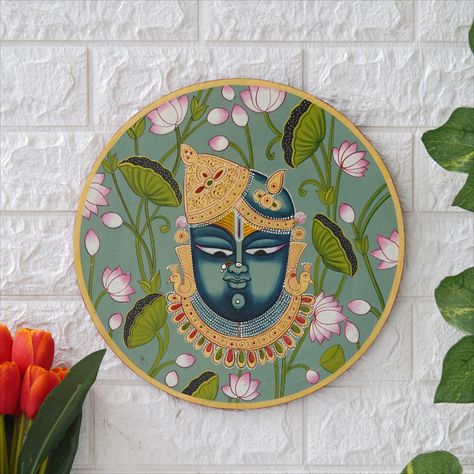 Elevate your home decor with the divine essence of our Handpainted Shreenath Ji Painting on Wooden Plate. This exquisite piece isn't just a decoration; it's a manifestation of spiritual devotion, artistic beauty, and the richness of Indian culture.
Meticulously handcrafted, the Shreenath Ji painting adorns a wooden plate with intricate details that capture the essence of the deity's presence. The vibrant colors, delicate brushwork, and authentic Indian artistry showcase the devotion. Shreenath Ji, Pichwai Cow, Cow Wall Decor, Pichwai Art, Diwali Design, Indian Gifts, Pichwai Paintings, Wooden Plate, Plate Wall