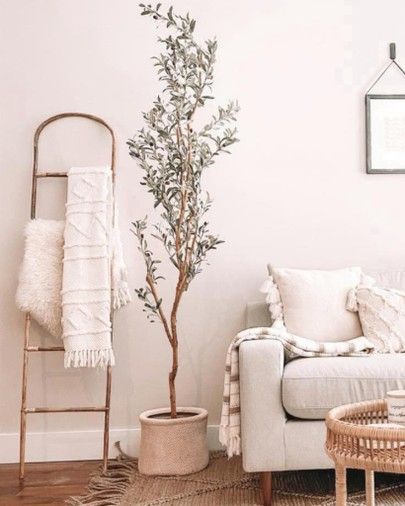 Decor Ladder Living Room, Floor Pillows Living Room Ideas, Lader Decoration, Decorative Ladder Living Room, Living Room Ladder Decor, Ladder In Living Room, Blanket Ladder Decor Living Room, Fake Tree Decor Living Room, Living Room With Plants Ideas