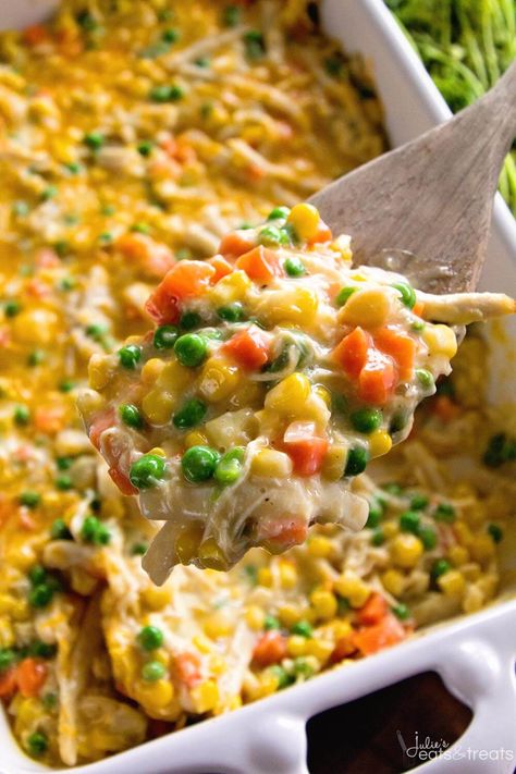 Cheesy Chicken Noodle Casserole ~ easy, hearty and comforting casserole loaded with chicken, peas, carrots, corn and egg noodles! | julieseatsandtreats.com Chicken Noodle Casserole Easy, Chicken Corn Casserole, Cheesy Chicken Noodle Casserole, Casserole With Corn, Chicken Hashbrown Casserole, Chicken Noodle Casserole Recipe, Chicken Peas, Casserole Dinners, Cheesy Chicken Casserole