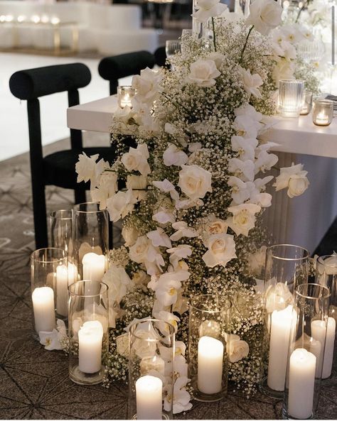 Flowers And Candles Centerpieces Wedding, Souviner Wedding Ideas, Modern Elegant Aesthetic, Hanging Dance Floor Installation, White Rose Table Runner, Gorgeous Wedding Flowers, Candles At A Wedding, Wedding Table Decorations White Flowers, Wedding Candles And Flowers