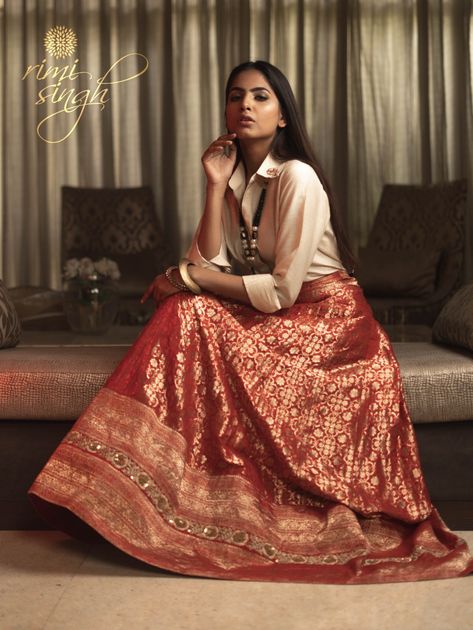 "SERENA" SPRING/SUMMER 20  Photography @angadkahaisingh  Red antique banarasi jaal skirt paired with a muga silk shirt. There is zardosi hand embroidery on the ghera ,  collar and at the back of the blouse..   Available exclusively at  Rimi Singh Studio A 999 Sushant Lok 1  Gurgaon  #9818310054. Satin Shirt With Lehenga, Banarsi Suit, Brocade Suits, Muga Silk, Traditional Photography, Netted Blouse Designs, Brocade Skirt, Dressing Ideas, Half Sarees