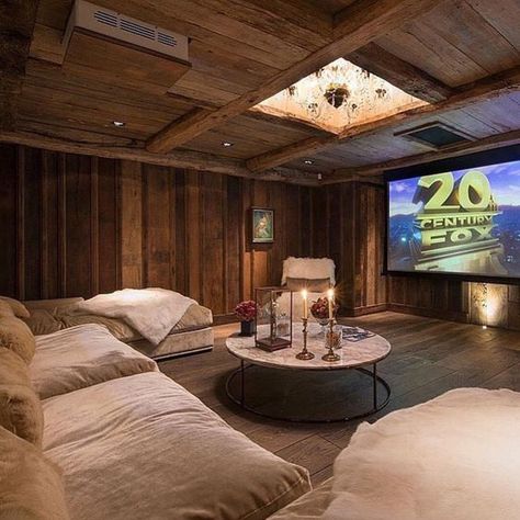 This rustic room is great because it has wood walls and ceiling. When paired with the plush style bed you've definitely got something comfortable and a lot of fun too. Small Home Theater, Home Theater Lighting, Sala Cinema, Room Theater, Basement Home Theater, Theater Decor, Home Theater Installation, Movie Room Decor, Home Cinema Room