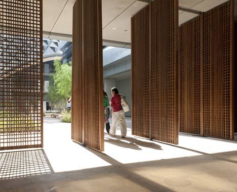 pivoting screens sleek natural wood delicate detailed Masdar City, Pacific Green, Interior Design Institute, Future Buildings, Foster Partners, Pivot Doors, Contract Furniture, Interior Barn Doors, Traditional Architecture