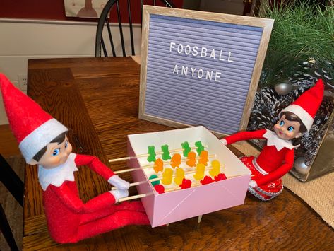 Elf On The Shelf Playing Foosball, Elf On The Shelf Dominos Pizza, Elf Ideas Creative, Pair Of Elf On The Shelf Ideas, Elf On The Shelf Siblings, Wrestling Elf On The Shelf, Elf On The Shelf Gumball Machine, Elf Foosball, Elf Games For Kids On The Shelf