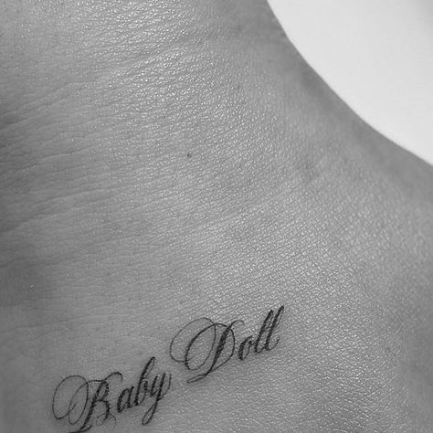 Mikella Blue on Instagram: "baby doll ♡  -  For booking click link in bio  -  #tattoo #losangeles #MikellaBlue #tattooartist #ladytattooer #fineline #blackandgrey #script #babydoll" Babydoll Tattoo Lettering, Doll Tattoo Word, Baby Doll Tattoo, Babydoll Tattoo, Tattoos For Baby Boy, Ethereal Tattoos, Baby Angel Tattoo, Girly Tattoo, Baby Tattoo