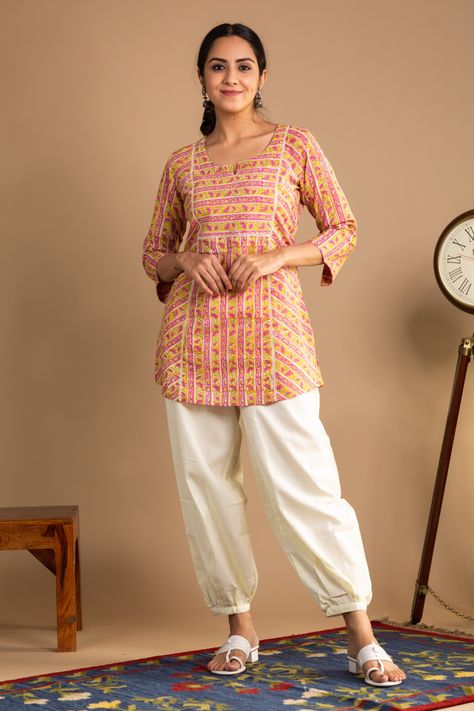 If you are looking for something light but professional, this short Kurti would be perfect for you. Made from 100% cotton, this Kurti lets you breathe, feels light and comfortable. And when it comes to the looks, the hand block print on yellow is just magic to the eyes. The short kurti for the best office look. Pair it with our bottoms for a perfect look. Just Magic, Short Kurti, Best Office, Office Look, Hand Block Print, Loose Pants, V Cuts, Colored Jeans, Printed Shorts