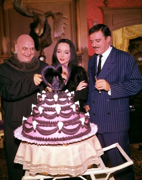 This shot from The Addams Family set looks entirely too colorful and happy. | 12 Jarring Color Images Of Black And White TV Shows Original Addams Family, The Addams Family 1964, Addams Family Tv Show, Gomez Morticia, John Astin, Uncle Fester, Morticia And Gomez, The Adams Family, Charles Addams