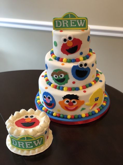 Sesame Street first birthday cake and smash cake by valerie o’cakes Sesame Street Birthday Smash Cake, Smash Cake Sesame Street, Sesame Street Birthday Party Cake, Sesame Street Birthday Party Ideas Cake, Elmo Birthday Cake 1st, Sesame Street First Birthday Party Ideas, Sesame Street Smash Cake 1st Birthdays, Elmo First Birthday Cake, Elmo Birthday Cake Boy