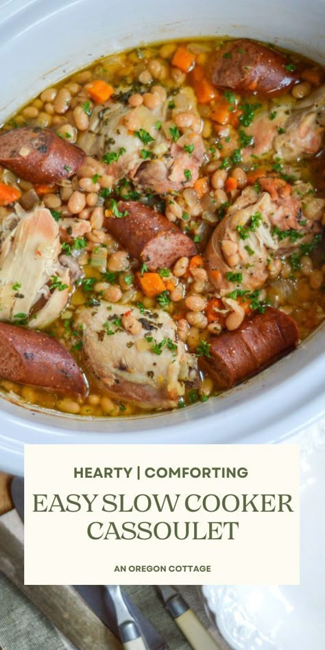 Less involved than the traditional French version but still full of all the amazing flavor, this slow cooker cassoulet recipe made with chicken and sausage is easy enough to make for busy weeknights, and special enough to serve to guests. Add this to your menu ASAP! Slow Cooker Cassoulet, Slow Cooker Meat And Veggies, Chicken And Sausage Crockpot, French Crockpot Recipes, Sausage Stew Slow Cooker, Cassoulet Recipe French, Greenpan Slow Cooker Recipes, Cassoulet Recipe Slow Cooker, Sausage Slow Cooker Recipes