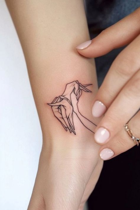 Tattoo of two hands creating an origami bird on a person's wrist. Unique Female Tattoos, Small Female Tattoos, Small Tattoo Designs For Women, Small Anchor Tattoos, Small Bee Tattoo, Tiny Designs, Small Cross Tattoo, Small Tattoos For Women, Female Tattoos