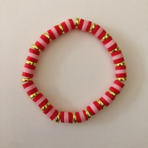 Super cute red, pink and gold polymer clay beaded bracelet. Stretchy and fits comfortably. Red Clay Bracelet Ideas, Red Clay Bracelet, Red Bracelet Ideas Clay Beads, Clay Was Bracelet Ideas, Clay Bead Bracelet Pink, Red Clay Bead Bracelet Ideas, Red Clay Bead Bracelet, Red Bracelet Ideas, Bracelets Preppy