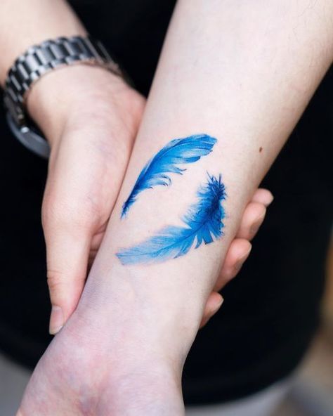 Blue Ink Tattoo, Feather Tattoo Wrist, Blue Ink Tattoos, Jamais Vu, Unique Tattoo Designs, Feather Tattoo, Baby Groot, Feather Tattoos, Blue Feather