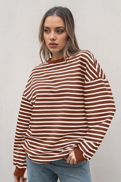 Elevate your everyday style with this effortlessly chic look. Featuring a cozy brown and white striped sweater paired with classic denim jeans, this outfit is perfect for casual outings. The subtle wavy hairstyle completes the relaxed ensemble, combining fashion and comfort seamlessly. . #FashionInspo #CasualOutfit #StripedSweater #EffortlessStyle #ChicLook #EverydayFashion White Striped Shirt Outfit, Striped Sweater Outfit, Preppy Tops, Fall Crewneck, Sweater Season, Fall Hoodies, Sweatshirt For Women, Y2k Outfits, Sports Hoodies