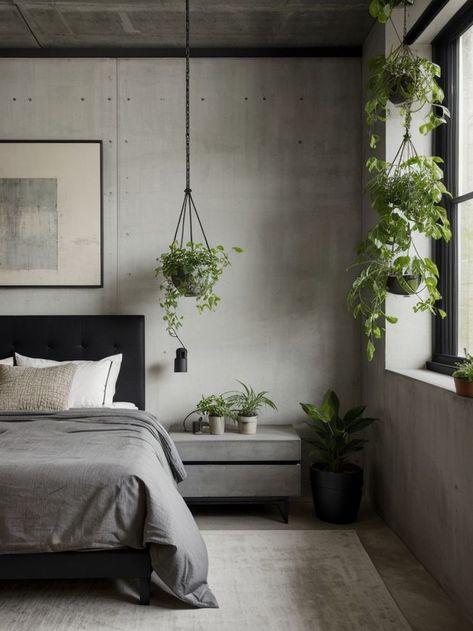 Elevate your urban design bedroom with a statement concrete accent wall and sleek black furniture. Add a touch of greenery with hanging plants and incorporate industrial lighting for a modern and edgy look. Concrete Apartment Aesthetic, Industrial Tropical Bedroom, Industrial Black Bedroom, Gray Bedroom With Plants, Soft Industrial Decor Bedroom, Industrial Themed Bedroom, Bedroom Ideas For Men Plants, Cement Bedroom Interior Design, Hanging Plants Above Bed