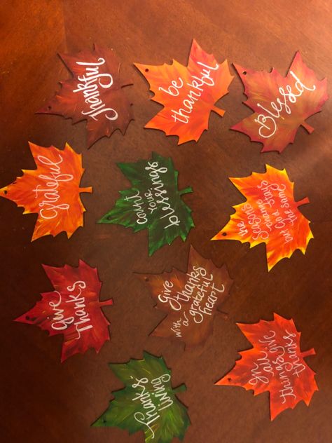 Diy Thanksgiving Tree Ornaments, Painting Wooden Leaves, Painted Wooden Leaves, Dollar Tree Leaf Cutout, Wood Leaf Crafts, Wooden Leaf Crafts, Dollar Tree Wooden Leaf Craft, Halloween Ornaments Diy, Easy Thanksgiving Decorations