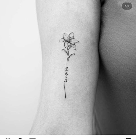 Lily Tattoo With Name As Stem, Lily And Name Tattoo, Lily Flower With Name Tattoo, Lily Flower Name Tattoo, Flower Stem With Name Tattoo, Fine Line Flower Name Tattoo, Flower Tattoo With Stem Writing, Flower Tattoo With Words As Stem Arm, Fine Line Flower Tattoo With Stem Writing