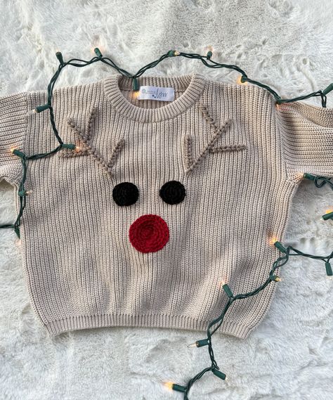 Hand Embroidered Holiday/Reindeer Sweater. One of our most popular holiday designs: the reindeer sweater!  MATERIALS/FIT: These sweaters have an oversized fit/feel and are a knit material, so they do have a stretch to them. They are 100% cotton. See approximate measurements below:  Size/Length/Chest      * 0-3 M / 11 in / 12 in     * 3-6 M / 11.5 in / 13 in     * 6-9 M / 12 in / 13.75 in     * 9-12 M / 13 in / 14.5 in     * 12-18 M / 14.25 in / 15.5 in     * 2T / 15.5 in / 16 in     * 3T / 16.5 Embroidered Name Sweater, Kids Christmas Sweater, Hand Embroidered Sweater, Embroidered Sweaters, Name Sweater, Reindeer Sweater, Kids Christmas Sweaters, Animal Sweater, Pull Bebe