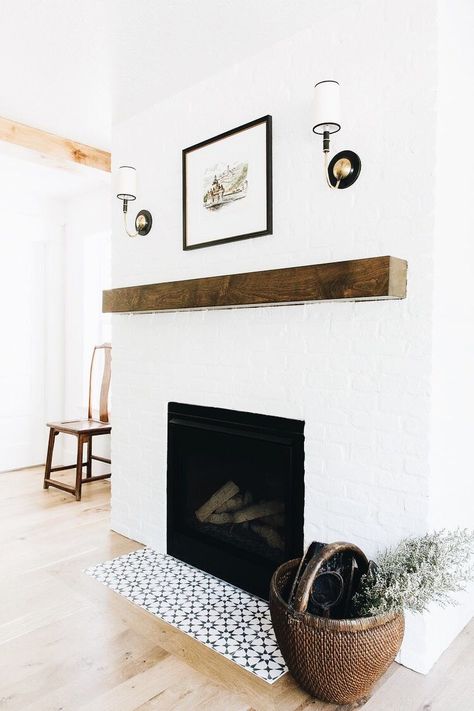 rustic wood beam fireplace mantel with painted brick and tile accents #fireplaceinspiration #fireplacemantel White Brick Fireplace, Painted Brick Fireplace, Painted Brick Fireplaces, Modern Remodel, Dining Room Fireplace, Wood Mantels, Fireplace Hearth, Fireplace Remodel, Home Fireplace