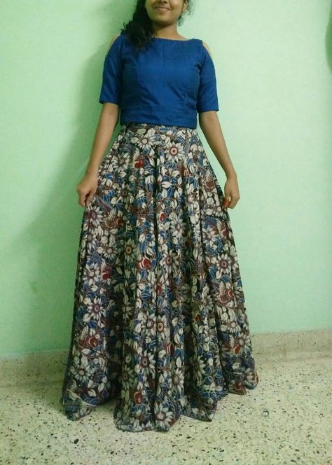 Crop top with cold shoulder and skirt. This makes me feel so cool. Good to wear for events with rich look. Kalamkari 😍😍😍😍 I'm on Instagram as @happystretchtimes. Install the app to follow my photos and videos. https://www.instagram.com/invites/contact/?i=11ab1wk2hxe2d&utm_content=iv3v8zj Kalamkari Crop Top And Skirt, Kalamkari Crop Top Lehenga, Kalamkari Skirt And Top, Kalamkari Skirts, Kalamkari Tops, Kurti Back Neck, Kurti Back Neck Designs, Kurthi Design, Net Saree Blouse Designs