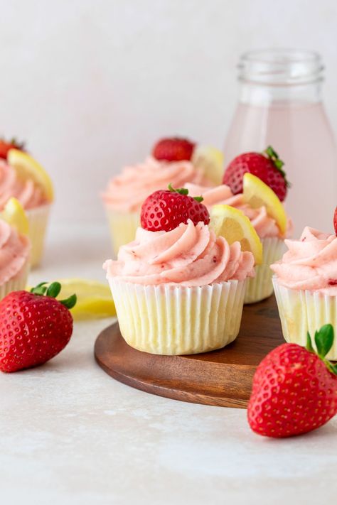 This easy strawberry lemonade cupcakes recipe features moist lemon cupcakes that are topped with strawberry buttercream frosting. Strawberry Lemonade Buttercream, Lemon Strawberry Cupcakes, Moist Lemon Cupcakes, Fruit Hand Pies, Peach Hand Pies, Strawberry Frosting Recipes, Mini Peach Pies, Strawberry Lemonade Cupcakes, Easy Strawberry Lemonade