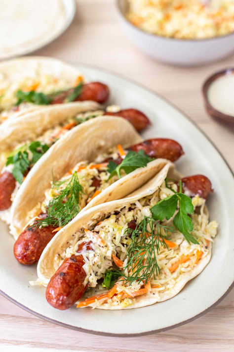 Hot Dog Coleslaw, Sausage Dog Recipes Dinners, Melty Mashups, Sausage Wraps Tortilla, Smoked Sausage Sandwich Recipes, Sausage Wraps, Sausage Sandwich, Creamy Peppercorn Sauce, Smoked Pork Recipes