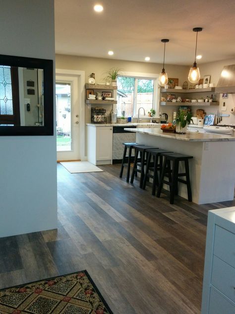 We opted for open shelving in the part of the Kitchen that is visible from the front entrance area/ hallway to give the space a welcoming homey feel. Appliances like microwave, Keurig and laundry machines are tucked away.We opted for white appliances to make them "disappear" or at least not seem so prominent. Kitchen Visible From Front Door, Front Door Entrance Into Kitchen, Front Entrance Into Kitchen, Front Door In Kitchen Layout, Kitchen Next To Front Door, Kitchen At Front Of House, Front Door Opens To Kitchen, Kitchen Near Front Door, Exterior Kitchen Doors