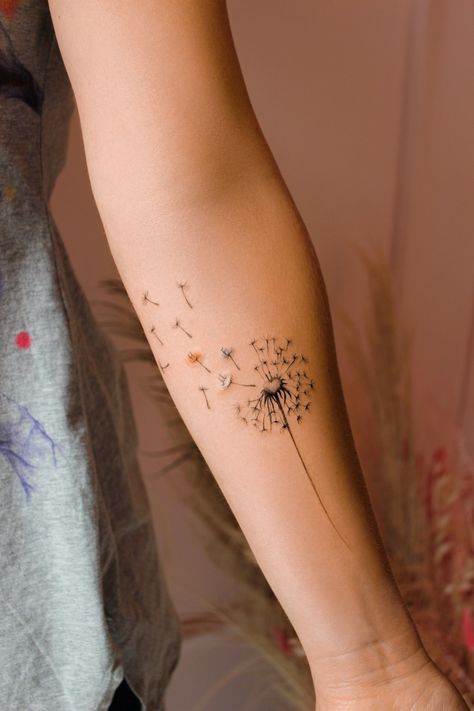 #floraltattoo #flowertattoo #dandeliontattoo Blow Flower Tattoo, Dandelion Child Tattoo, Dandelion Tattoo On Wrist, Tattoo Ideas Dandelion, Dandelion Tattoo Design Simple, Wish Flower Tattoo, Dandelion Tattoo Design For Women, Fine Line Dandelion Tattoo, Dandilines Flower Tattoo