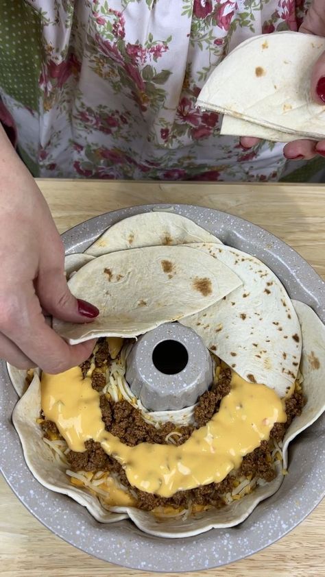 Easy taco dinner | taco, dinner | Easy taco dinner Kiera J takes a bundt cake pan and make a new type of taco This video was produced by Kiera J and Network Media, LLC. | By Kiera & Ryan & Danny & Justine | Facebook | Just making me a little ring of these tortillas inside this bump pan. And y'all I'm using the fajita size ones. These are my favorite size. I just think they're perfect for just about everything I need them for. I went ahead and ground me up some ground beef. And I added a little Bundt Cake Casserole, Taco Ring With Tortillas Bundt Pan, Bundt Pan Lasagna, Taco Bundt Cake, Bundt Pan Taco Ring, Easy Taco Dinner, Dorito Taco Casserole, Bubble Up Enchiladas, Taco Casserole Bake